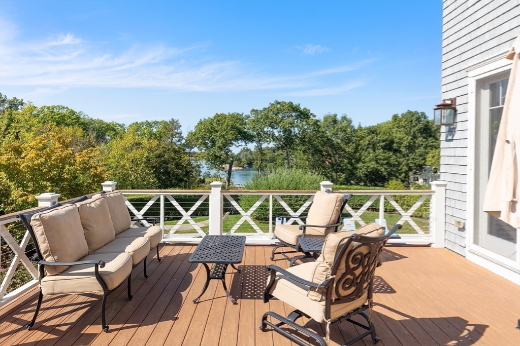17 Mohawk Way Cohasset, MA 02025 - Photo 8 of 33 a view of chair and tables on the roof deck