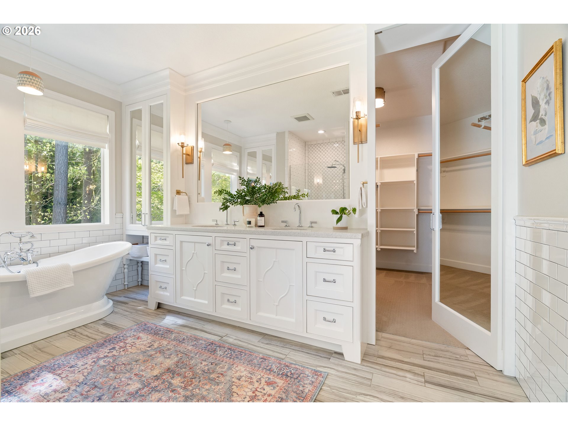 14401 Southeast Summit Court Clackamas, OR 97015 - Photo 22 of 47 a spacious bathroom with a double vanity sink a two mirror a bathtub and next to a window