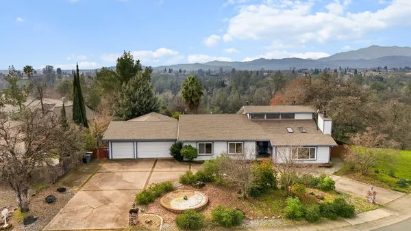 an aerial view of a house with a garden