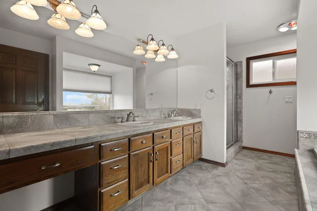 a kitchen with stainless steel appliances granite countertop a stove and a sink