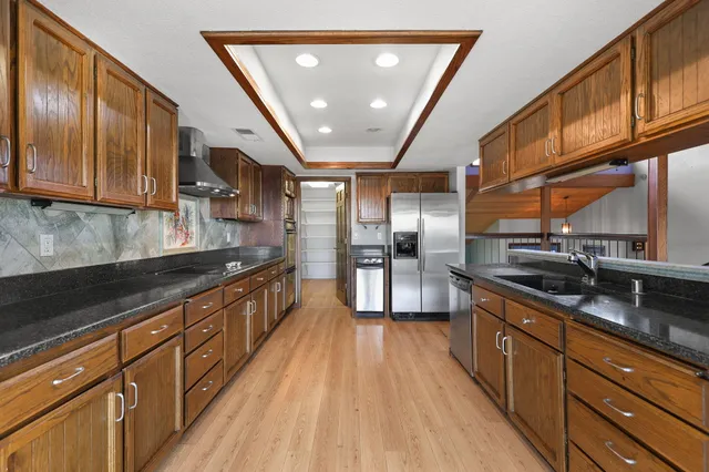 a view of a balcony with wooden floor