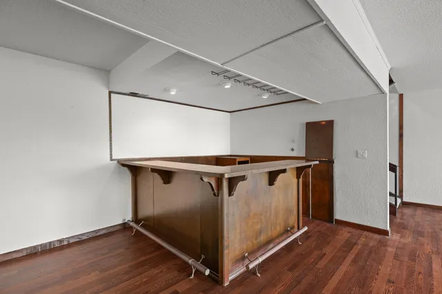 a view of a house with a yard and garage