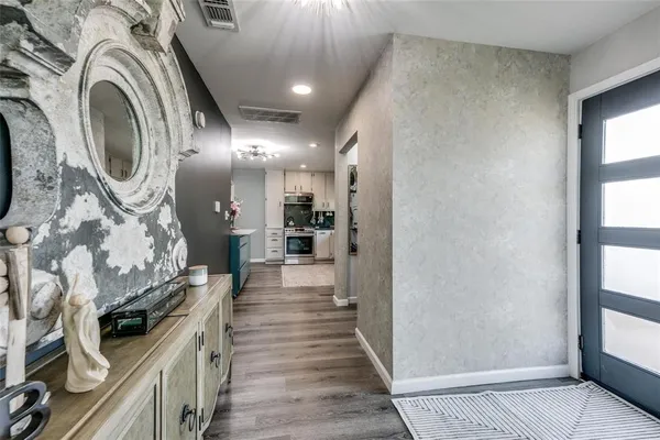 a view of a hallway with washer and dryer
