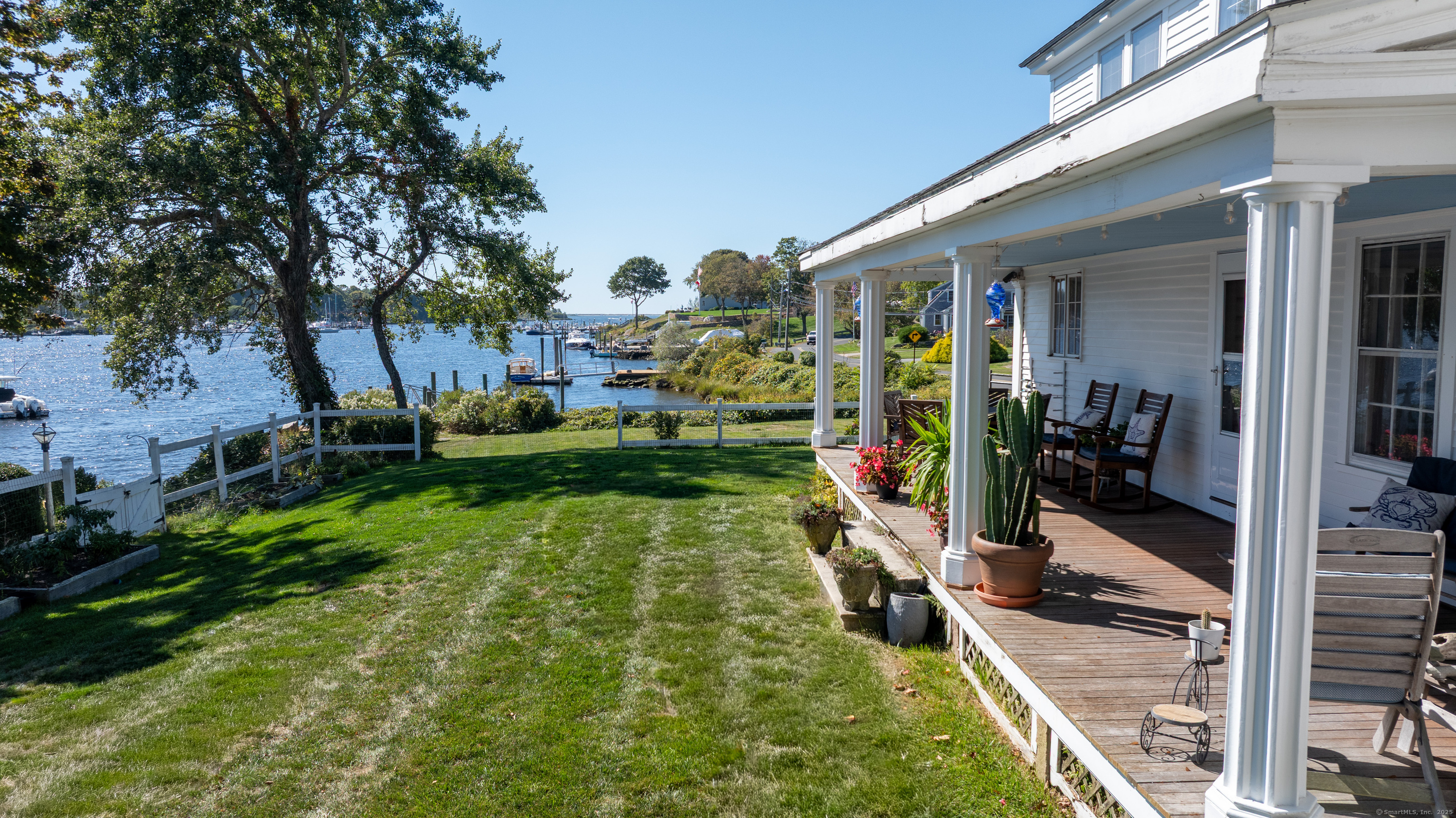 a view of a porch with furniture and floor to ceiling window