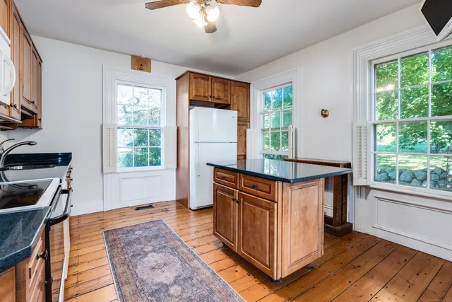 a spacious bedroom with a bed and a walk in closet
