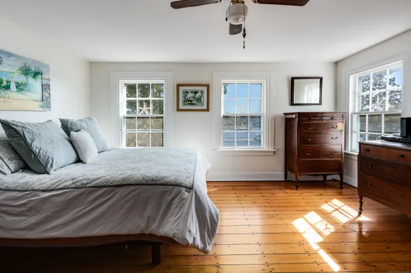 a spacious bedroom with a bed and a walk in closet