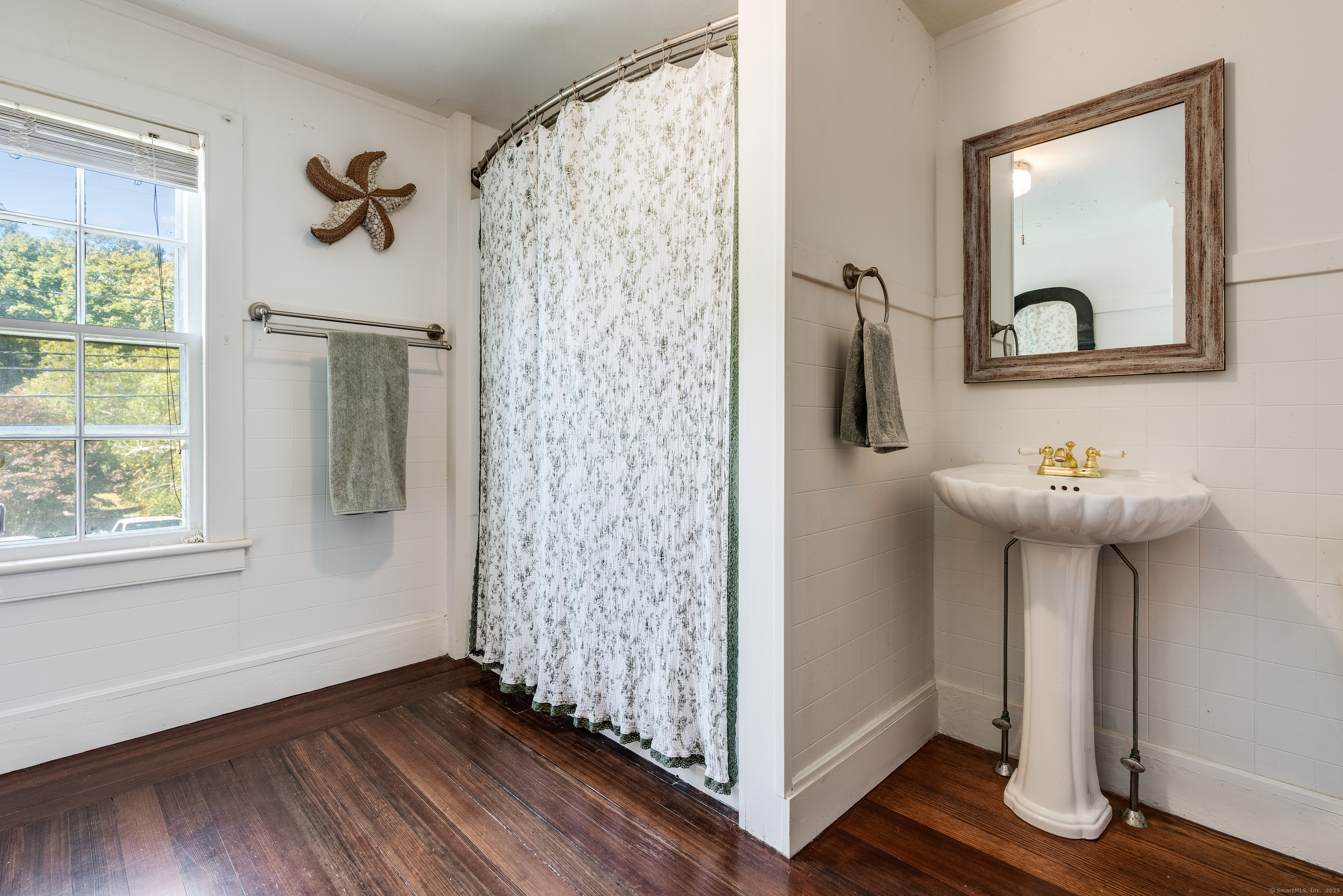 417 River Road Stonington, CT 06379 - Photo 24 of 39 a view of a hallway with wooden floor and entryway