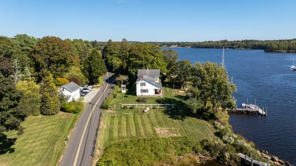 aerial view of a house with a yard