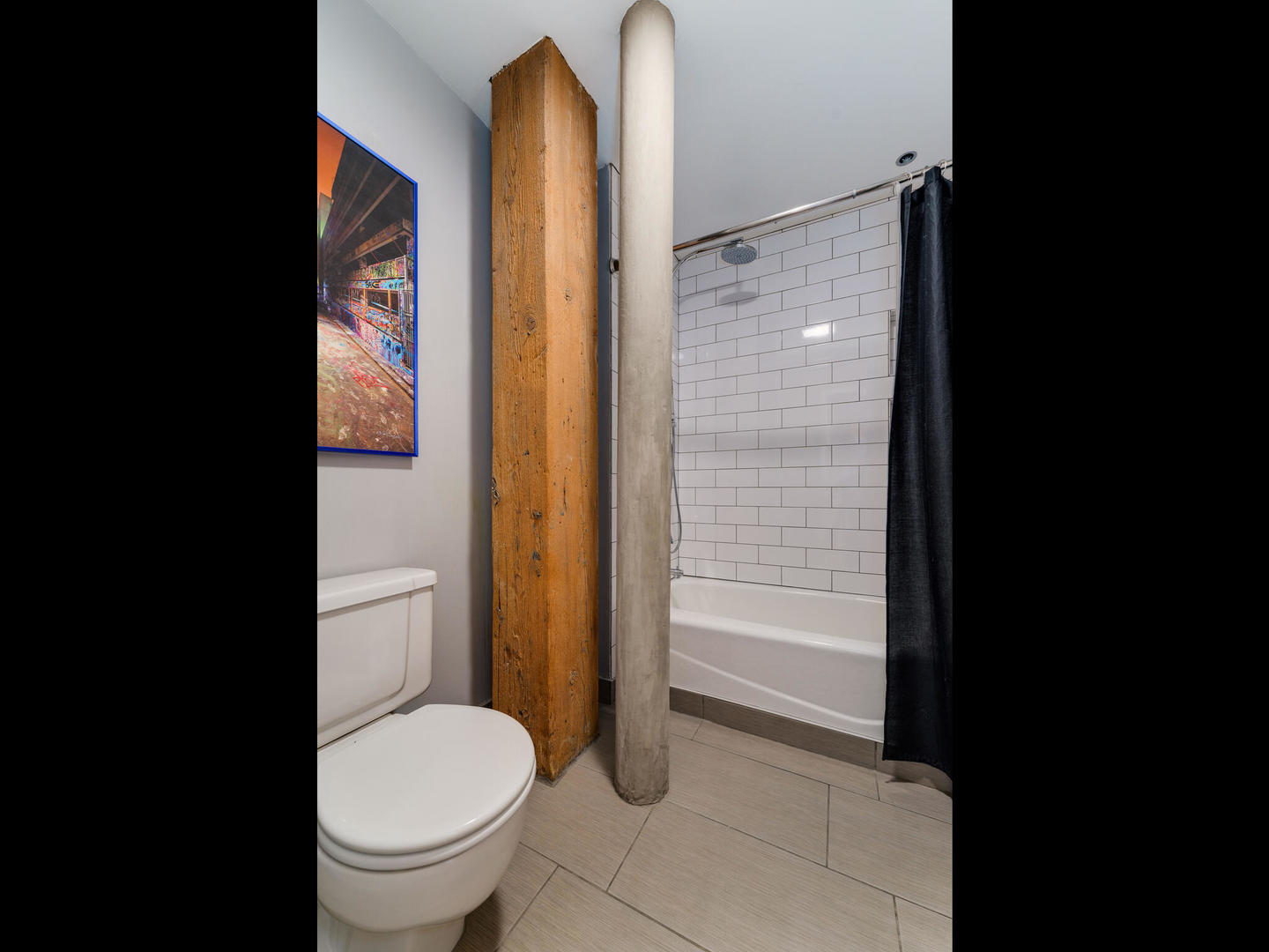 1733 West Irving Park Road, Unit 306 Chicago, IL 60613 - Photo 11 of 15 a bathroom with a toilet and a shower
