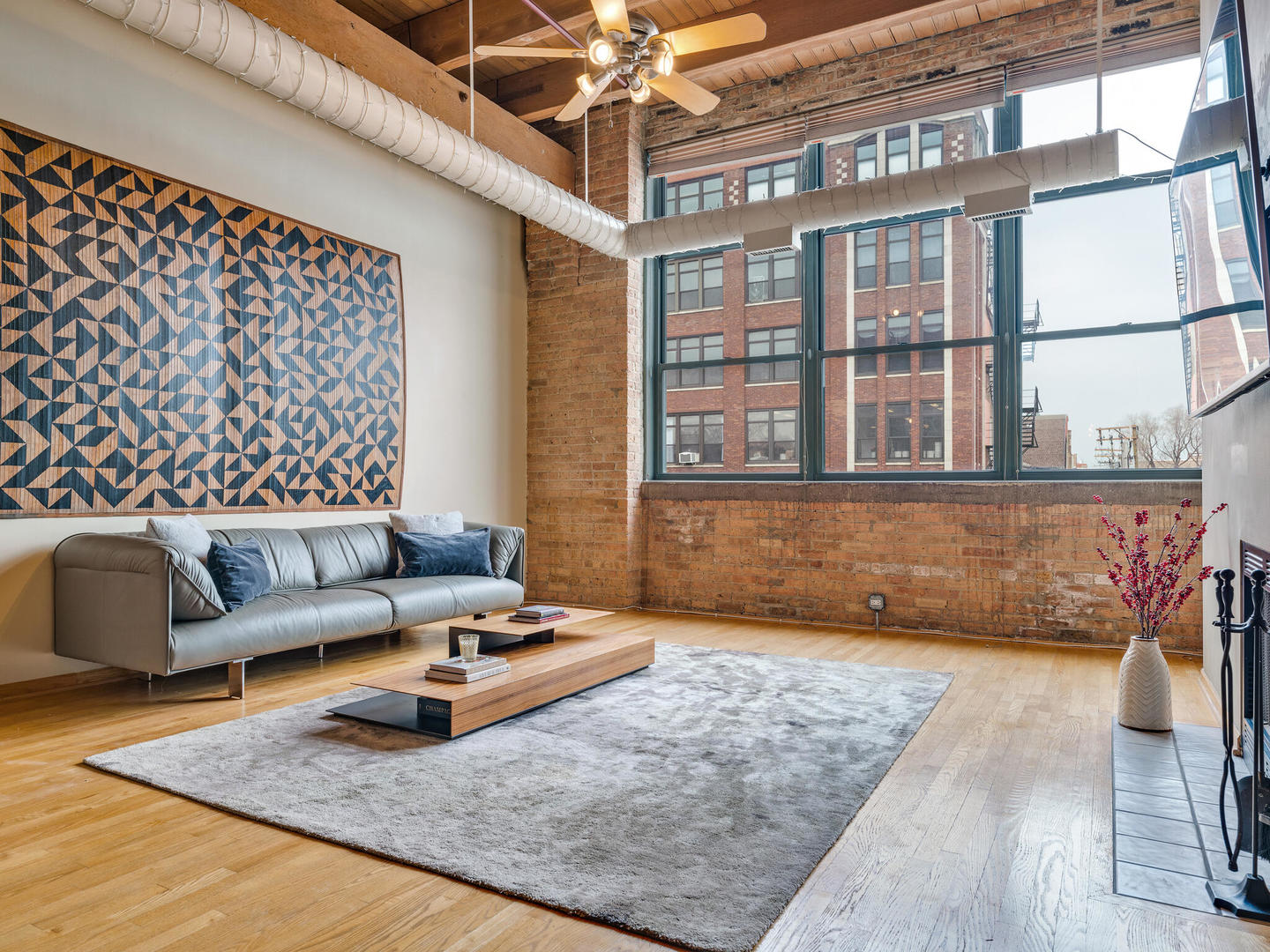 1733 West Irving Park Road, Unit 306 Chicago, IL 60613 - Photo 3 of 15 a living room with furniture rug and window