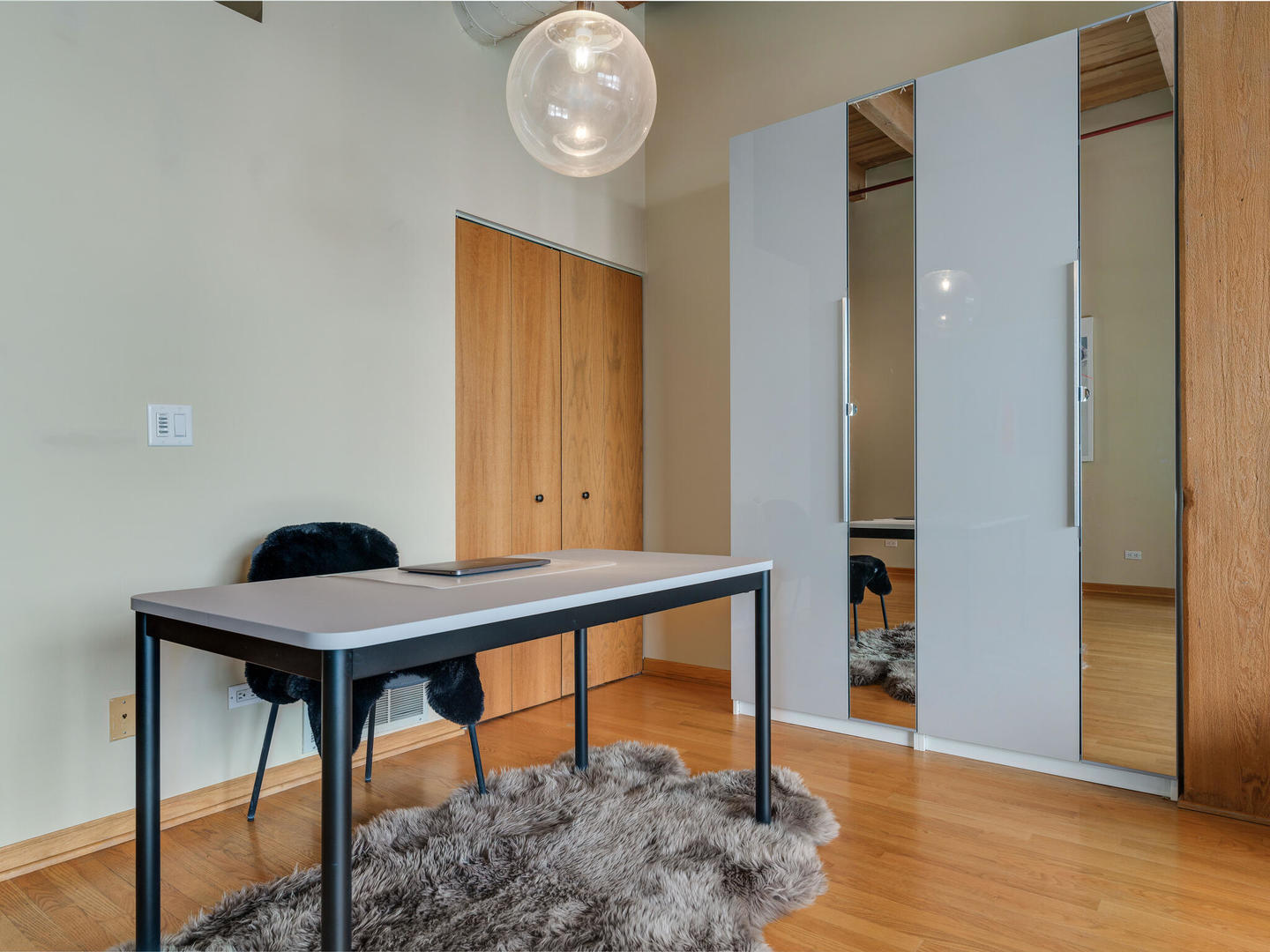 1733 West Irving Park Road, Unit 306 Chicago, IL 60613 - Photo 6 of 15 a view of a livingroom with furniture and wooden floor