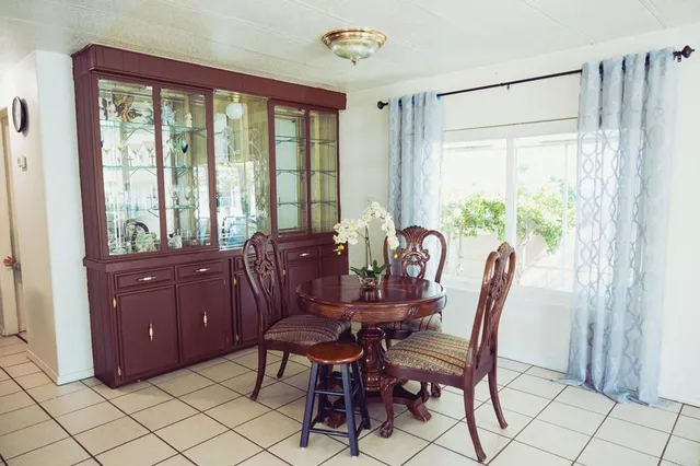 a view of a dining room with furniture window and outside view