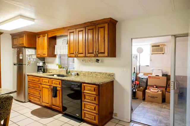 a view of a kitchen with furniture and a window