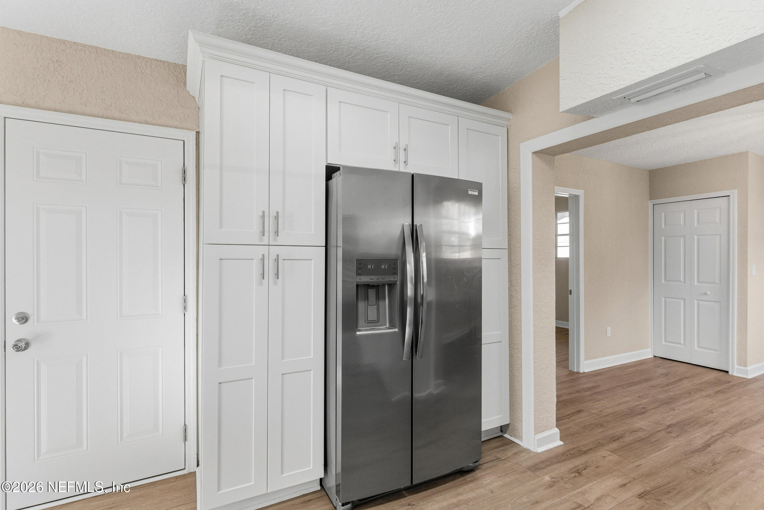 10531 Rutgers Road Jacksonville, FL 32218 - Photo 11 of 32 a metallic refrigerator freezer sitting in a kitchen