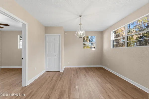 a view of livingroom with hardwood floor and kitchen view
