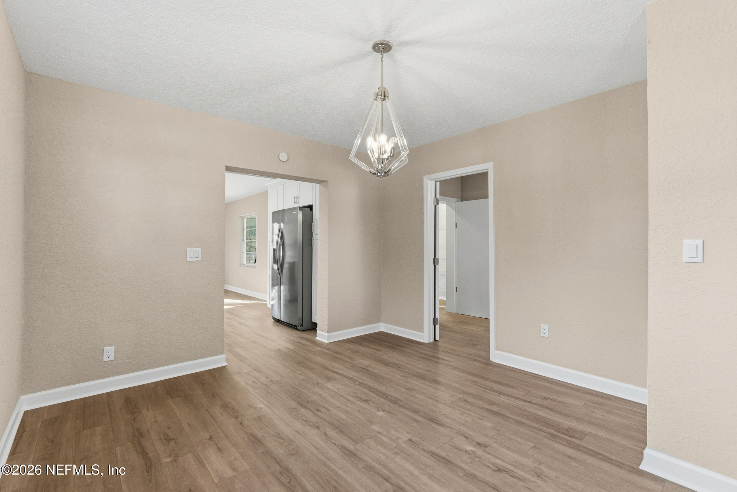 10531 Rutgers Road Jacksonville, FL 32218 - Photo 13 of 32 a view of livingroom with hardwood floor and kitchen view