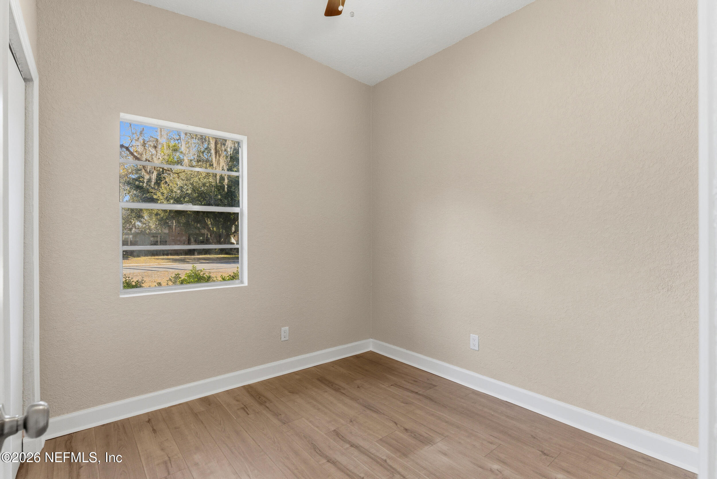 10531 Rutgers Road Jacksonville, FL 32218 - Photo 24 of 32 an empty room with a window