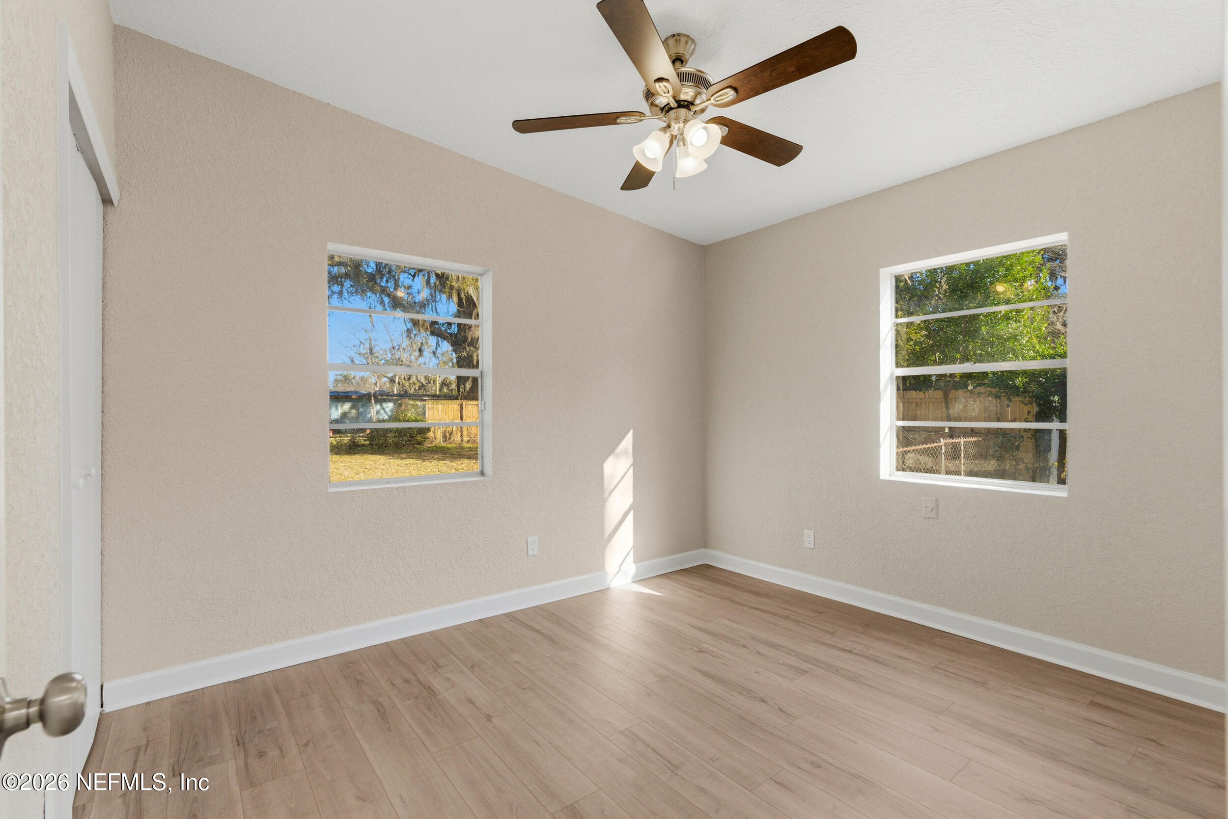 10531 Rutgers Road Jacksonville, FL 32218 - Photo 26 of 32 wooden floor in an empty room with a window