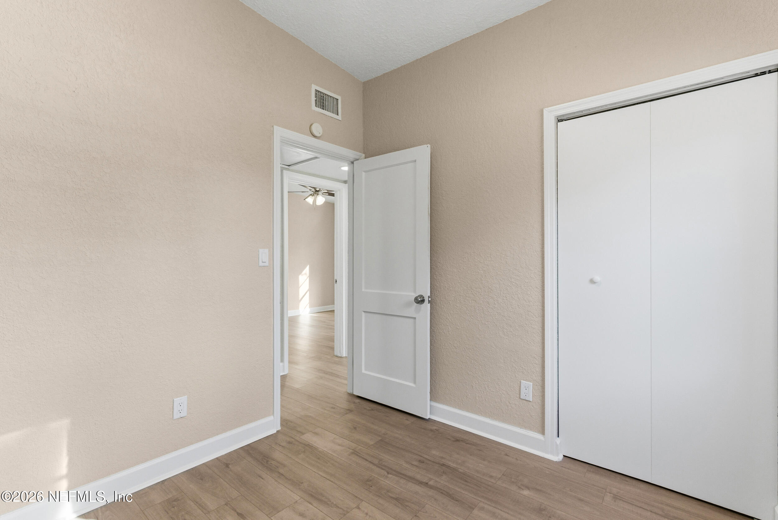 10531 Rutgers Road Jacksonville, FL 32218 - Photo 28 of 32 a view of an empty room with wooden floor