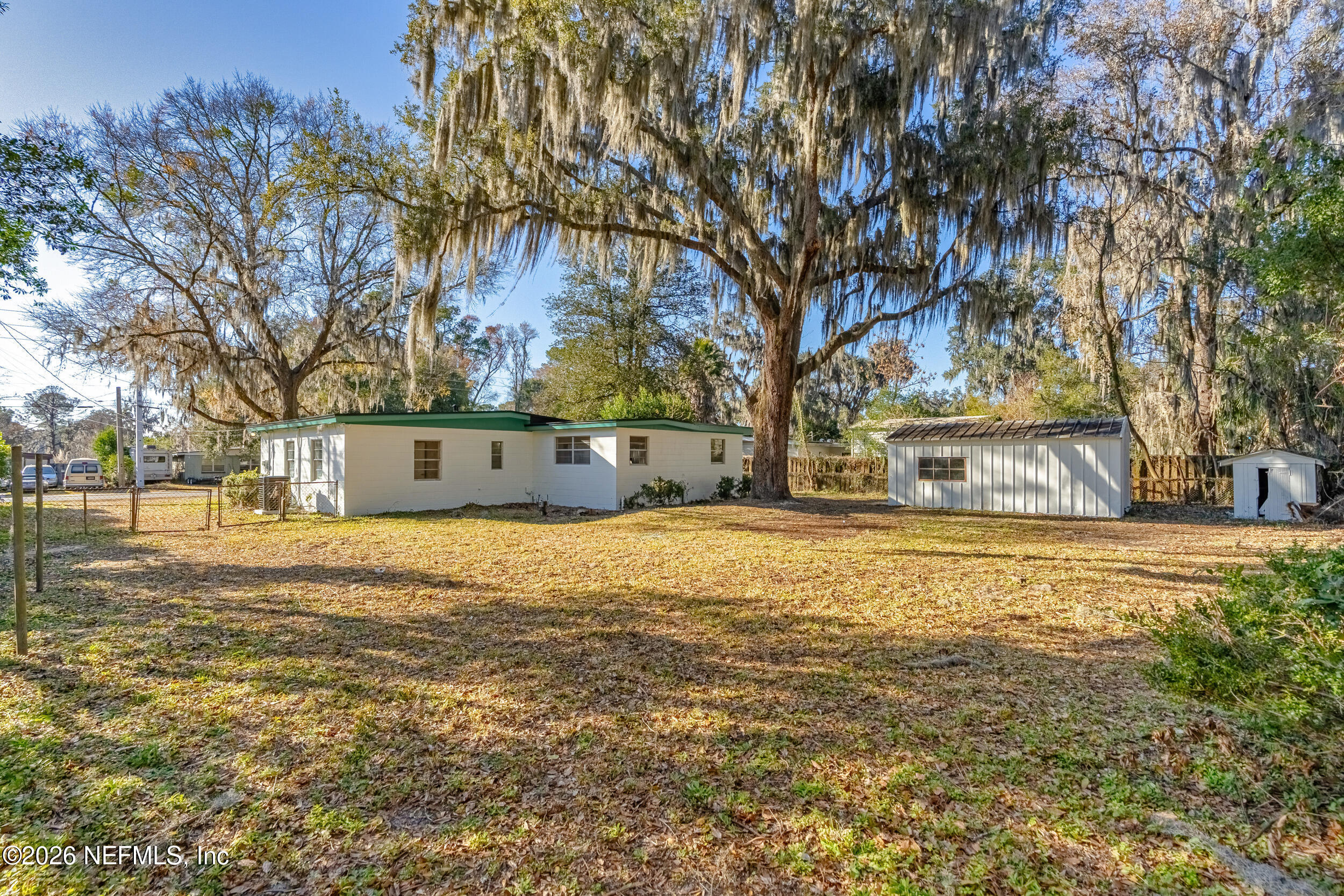 10531 Rutgers Road Jacksonville, FL 32218 - Photo 29 of 32 a view of swimming pool with large trees