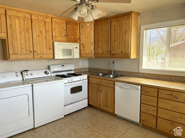 247 West 400 North, Unit 1 Moab, UT 84532 - Photo 12 of 27 Kitchen featuring white appliances, light tile patterned floors, light countertops, a ceiling fan, and independent washer and dryer