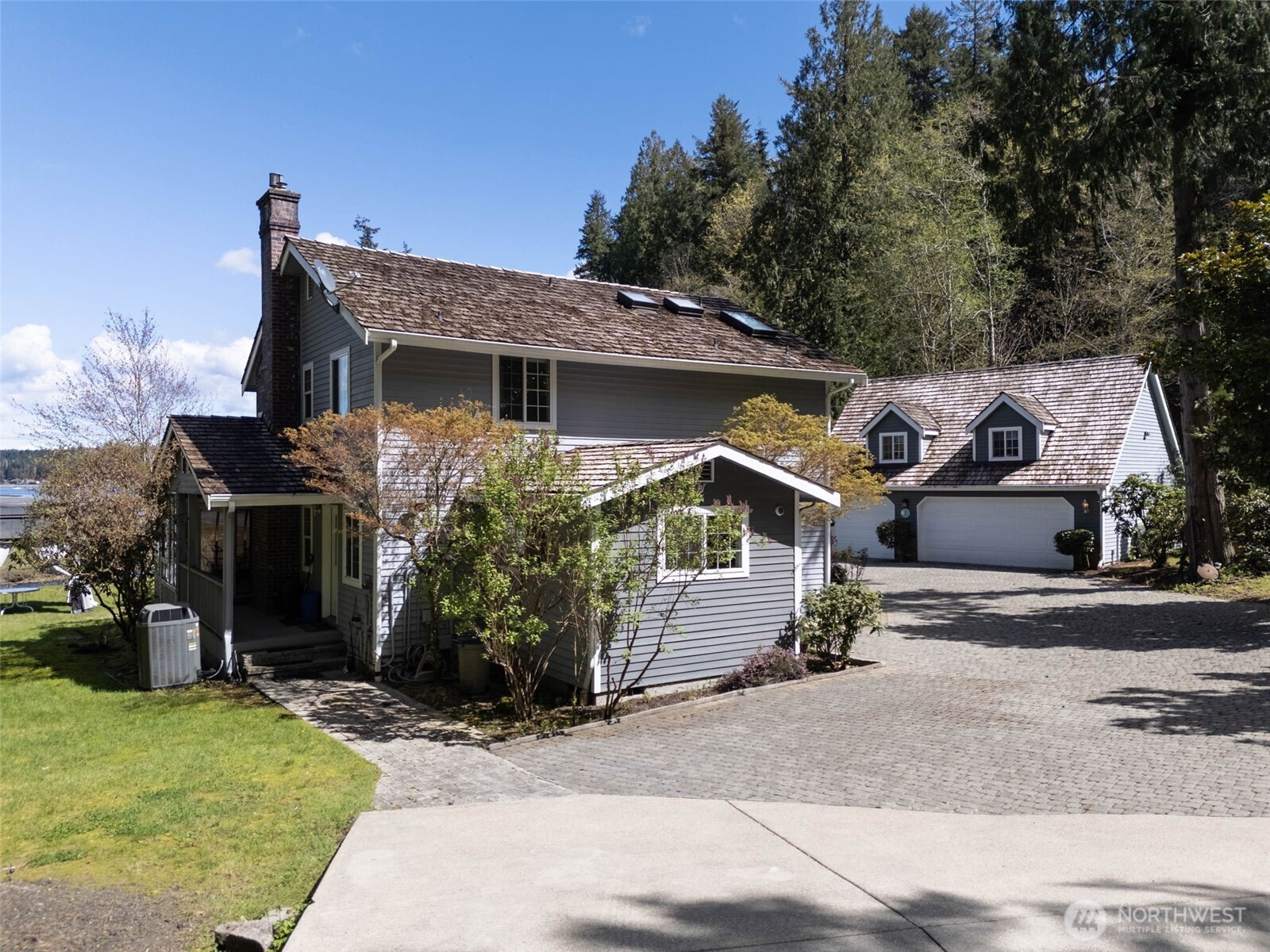 8320 East Grapeview Loop Road Allyn, WA 98524 - Photo 36 of 38 a front view of a house with a yard