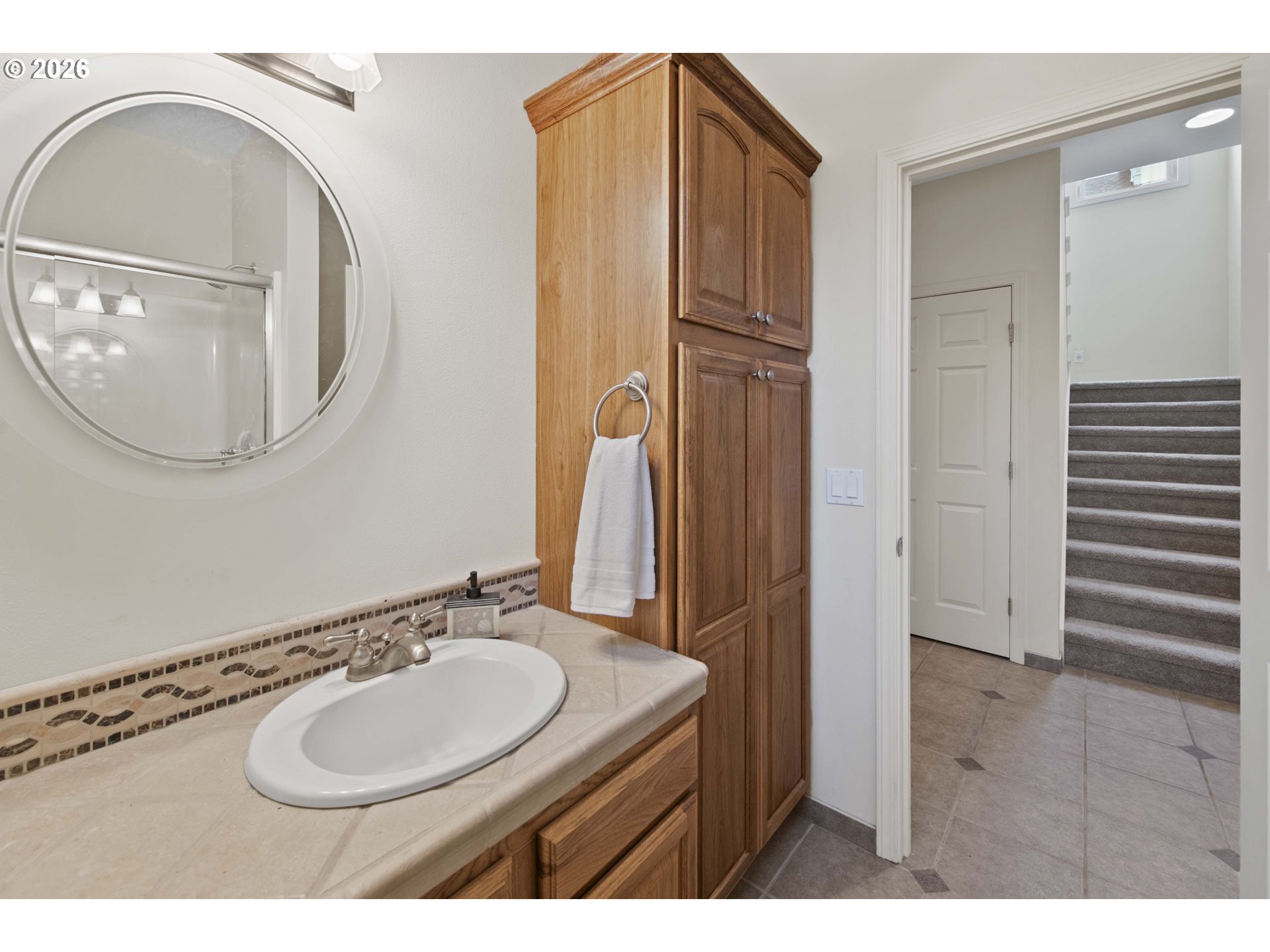 230 Round House Road Astoria, OR 97103 - Photo 18 of 43 a bathroom with a sink and a mirror