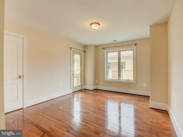 a kitchen with stainless steel appliances a refrigerator and a stove top oven