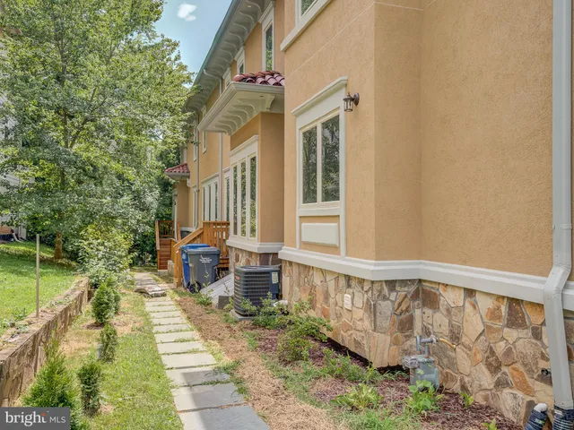 a kitchen with a sink refrigerator and cabinets