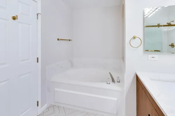 a bathroom with a bathtub and shower