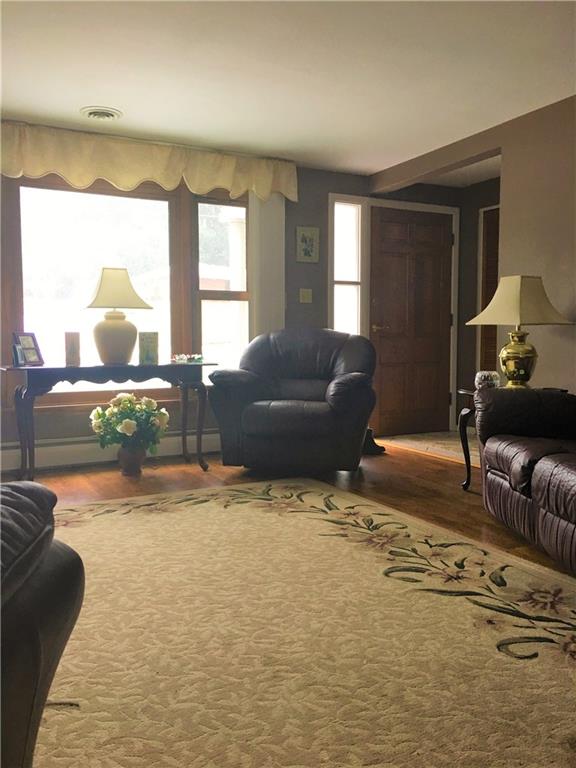 118 Beacon Road Renfrew, PA 16053 - Photo 3 of 24 Generous sized main floor living room spacious enough for large furniture. Overlooks the plush front yard with a high quality replacement window.