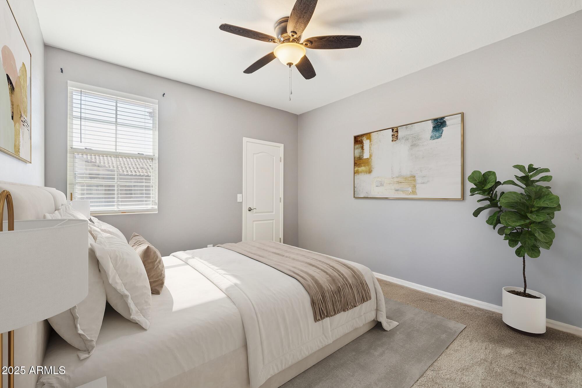 4124 East Toledo Street Gilbert, AZ 85295 - Photo 18 of 33 a bedroom with a bed and a potted plant