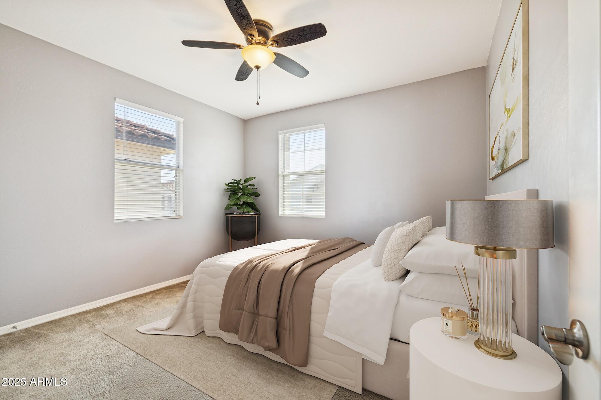 4124 East Toledo Street Gilbert, AZ 85295 - Photo 19 of 33 a bedroom with a bed and a chandelier