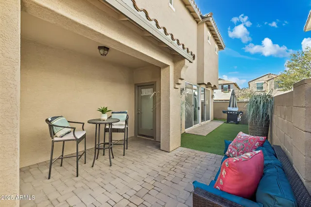 a view of a porch with furniture and a fire pit