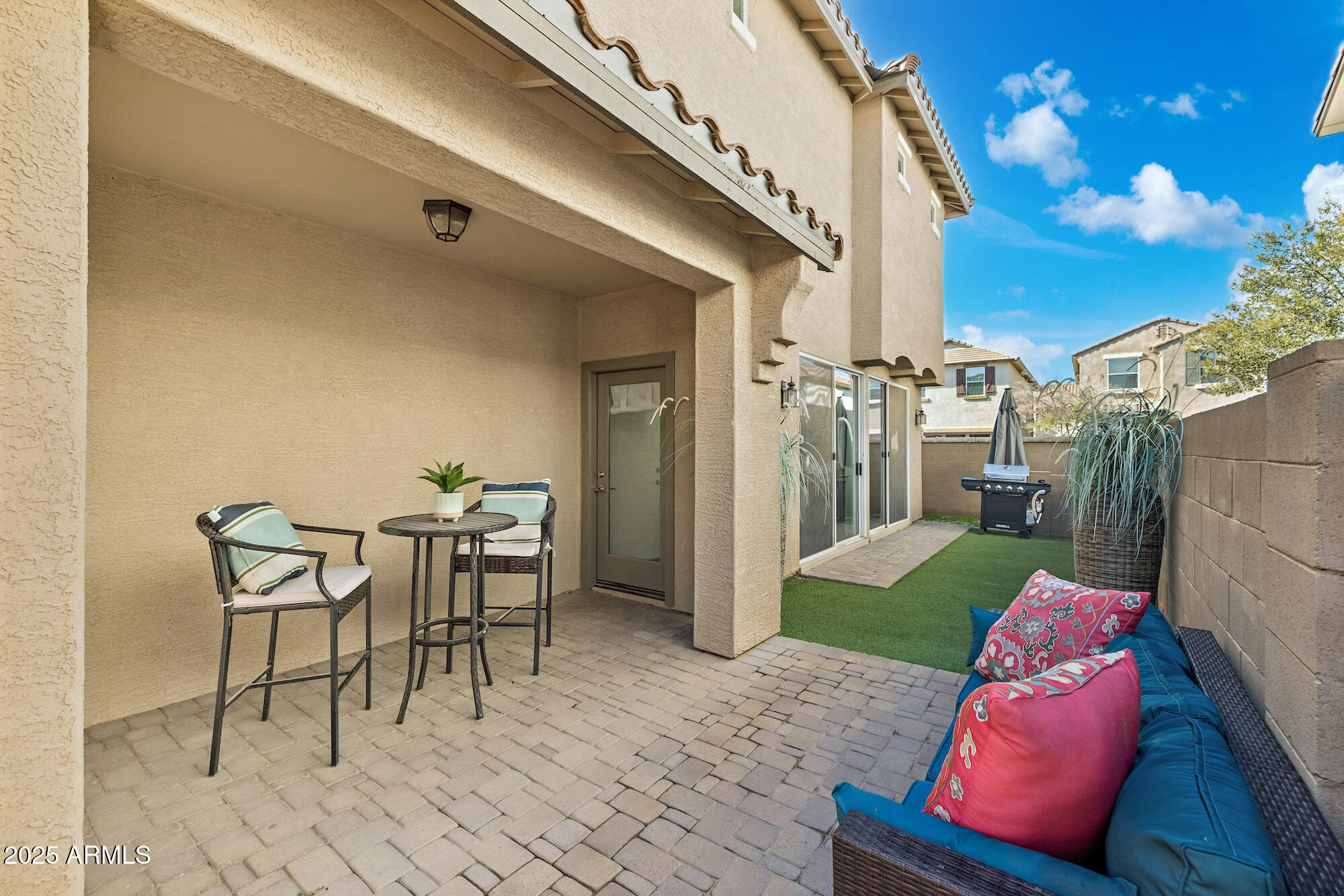 4124 East Toledo Street Gilbert, AZ 85295 - Photo 25 of 33 a view of a porch with furniture and a fire pit