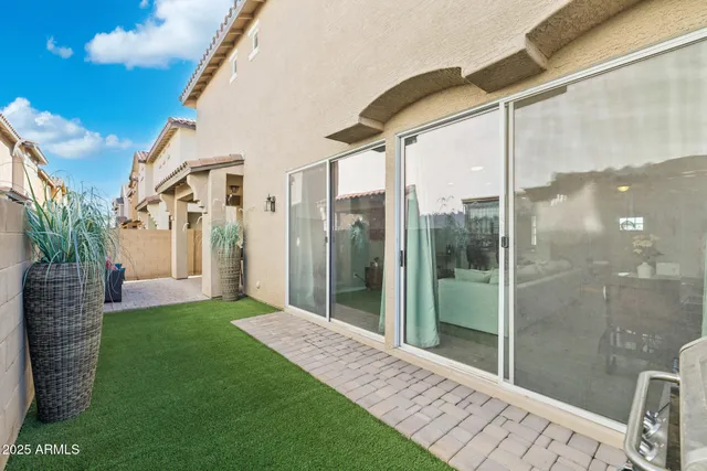 a bathroom with a glass door shower and a yard