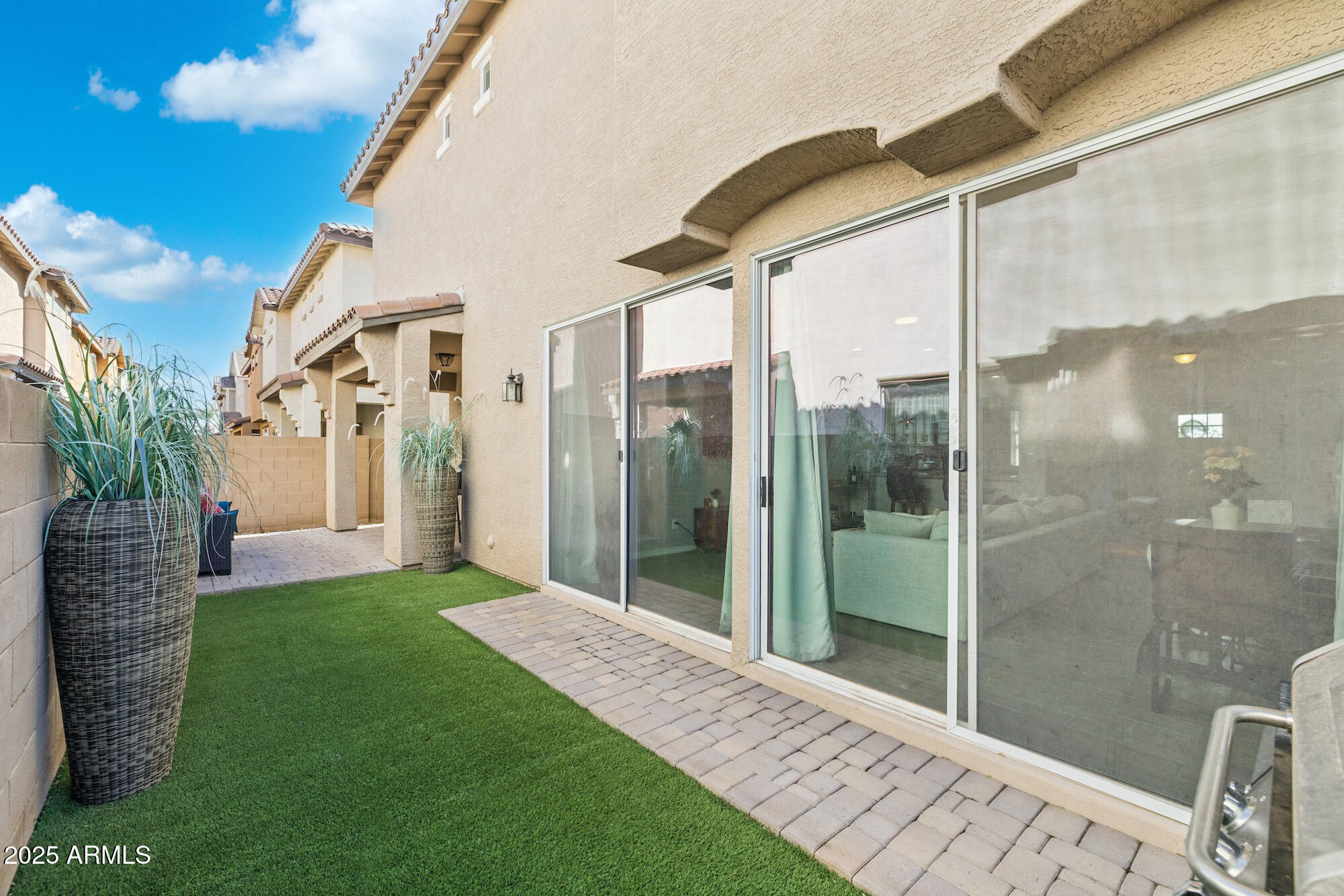 4124 East Toledo Street Gilbert, AZ 85295 - Photo 26 of 33 a bathroom with a glass door shower and a yard