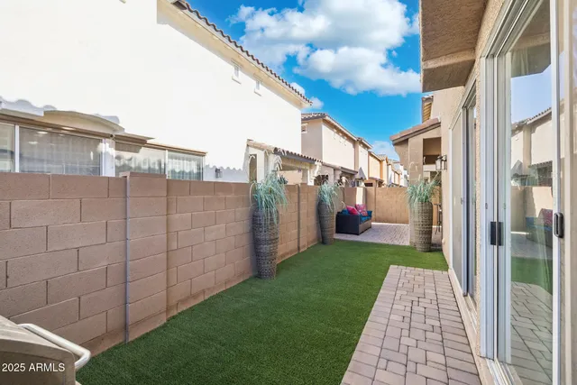 a view of a brick house with a yard