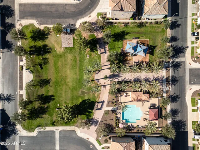 an aerial view of a house with a yard