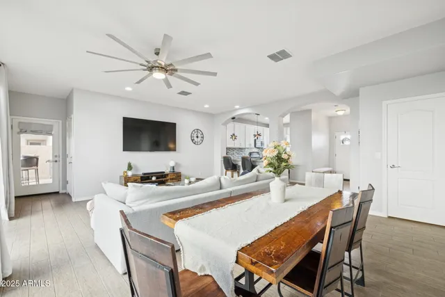 a dining room with furniture and window