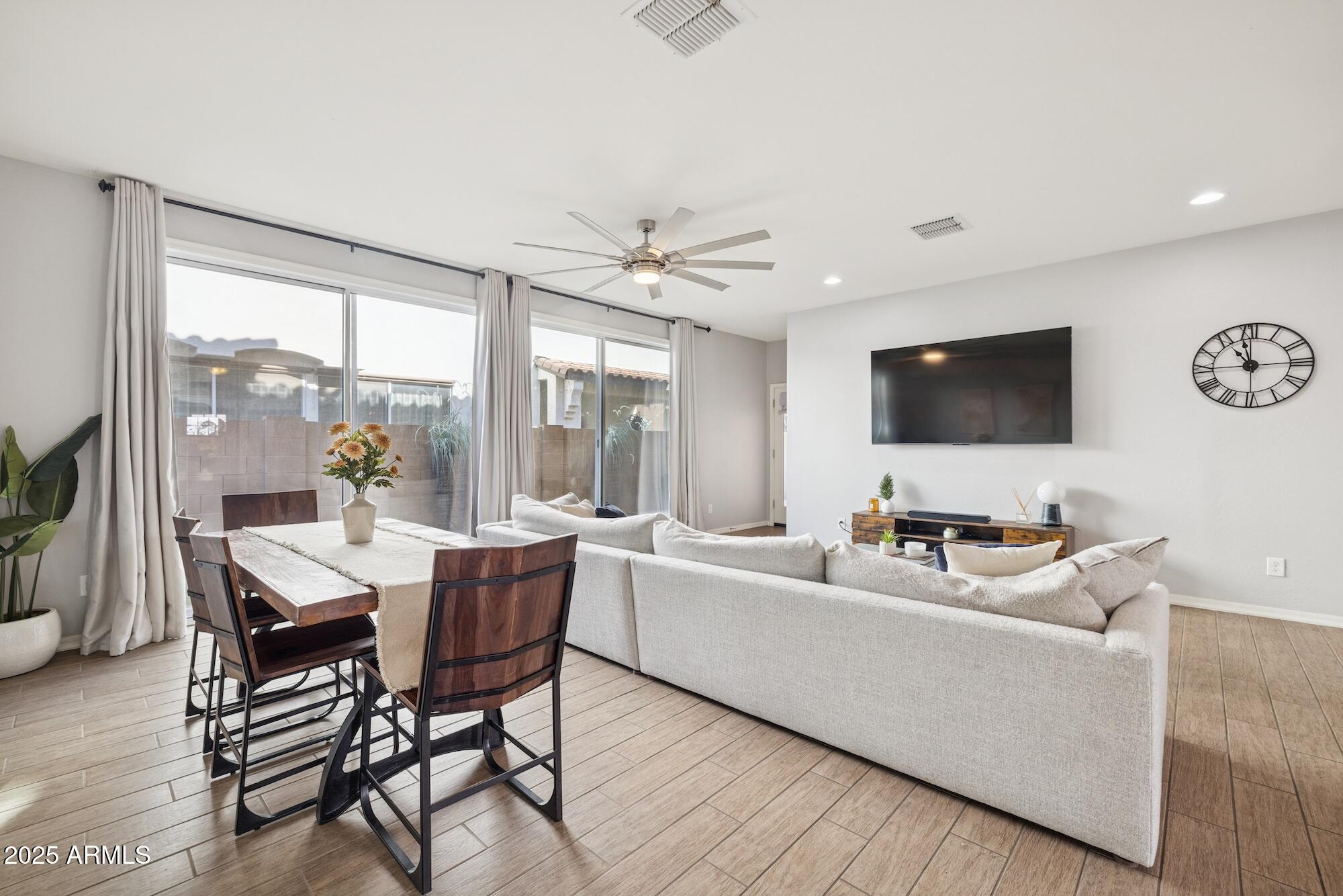 4124 East Toledo Street Gilbert, AZ 85295 - Photo 9 of 33 a living room with furniture and a flat screen tv