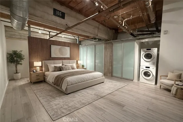 a spacious bedroom with a bed a couch and a table