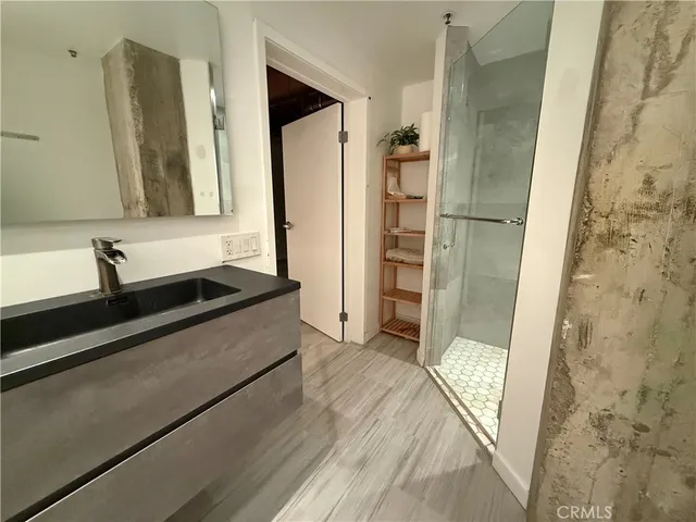 a bathroom with a double vanity sink and mirror