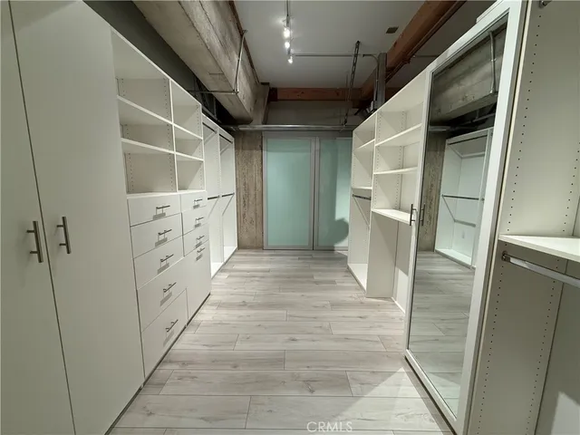 a bathroom with white cabinets
