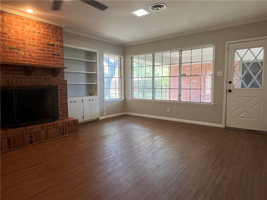 749 San Patricio Avenue Taft, TX 78390 - Photo 17 of 40 an empty room with windows and fireplace
