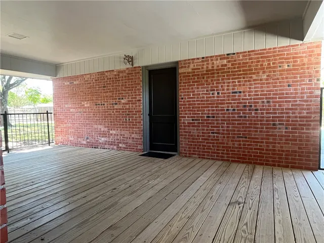 a view of outdoor space with wooden floor