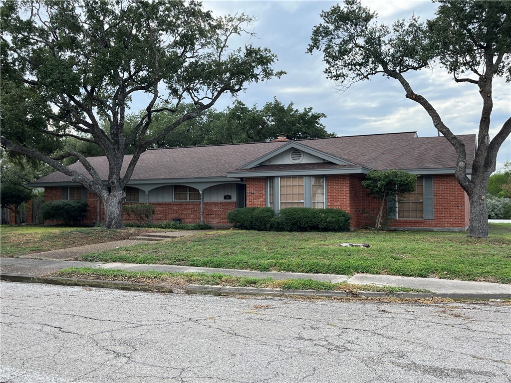 749 San Patricio Avenue Taft, TX 78390 - Photo 2 of 40 a front view of a house with a yard