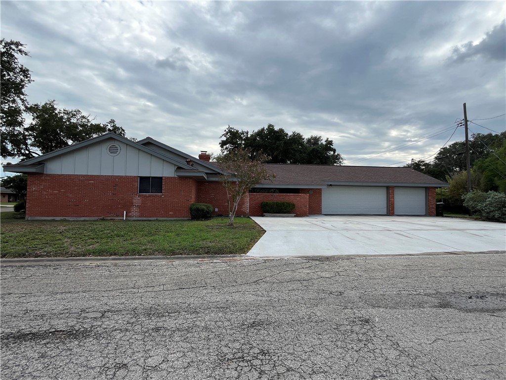 749 San Patricio Avenue Taft, TX 78390 - Photo 3 of 40 a front view of a house with a yard and garage