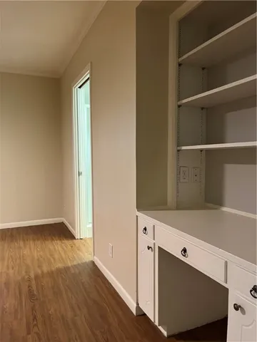 a view of cabinets and wooden floor