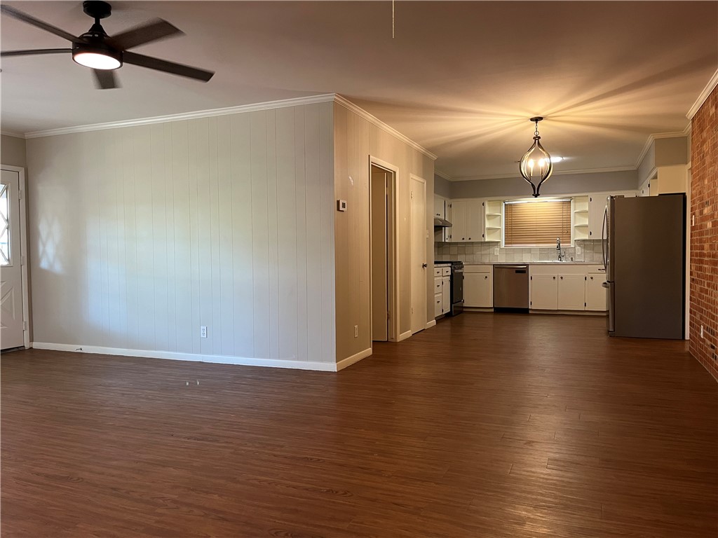 749 San Patricio Avenue Taft, TX 78390 - Photo 37 of 40 a view of a kitchen with a sink and a refrigerator